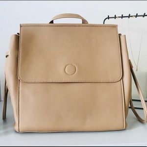 Shop Simple Essentials Bags - Contemporary Vegan Leather Backpack- Beige Shop Simple Essentials Bags - Contemporary Vegan Leather Backpack- Beige